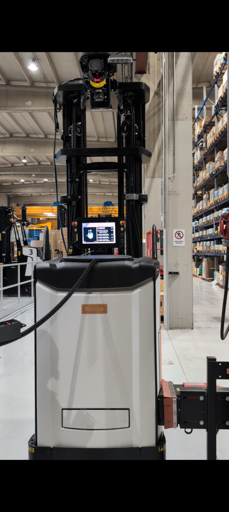 Automated guided vehicle standing in the warehouse environment