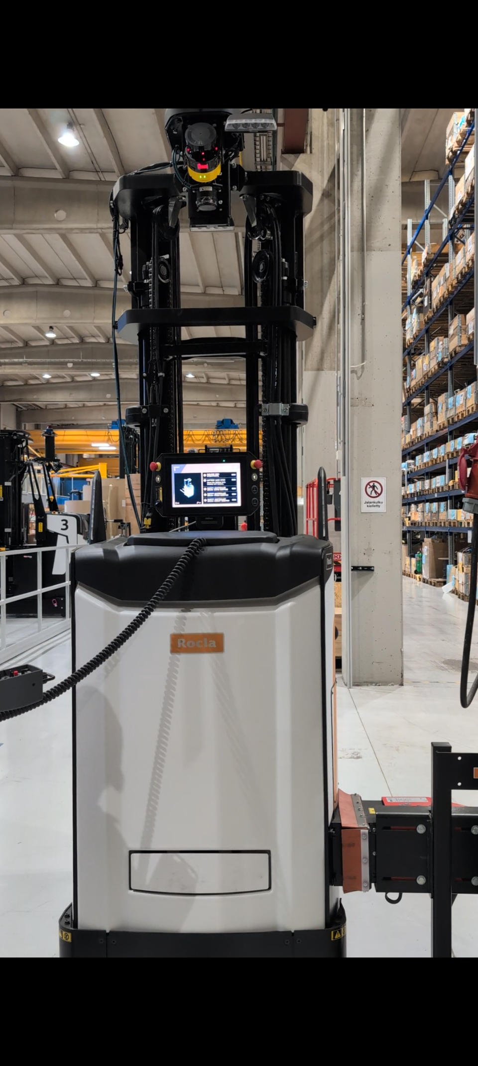 Automated guided vehicle standing in the warehouse environment
