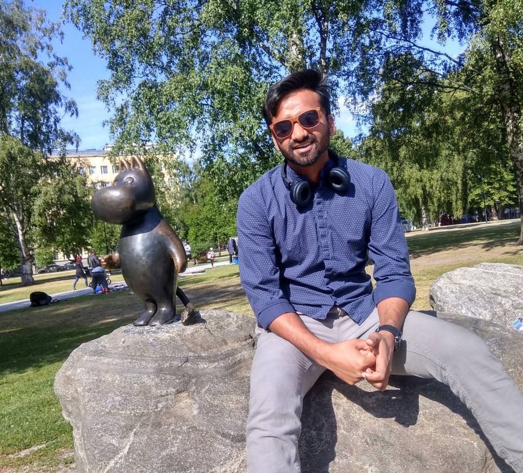 Satyam sitting on a rock