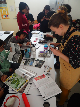 Students sharing ideas in front of a table