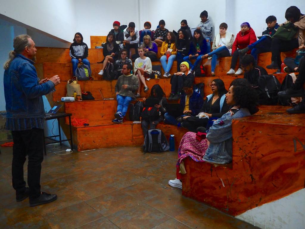 Juha Suonpää teaching a group of media and arts students