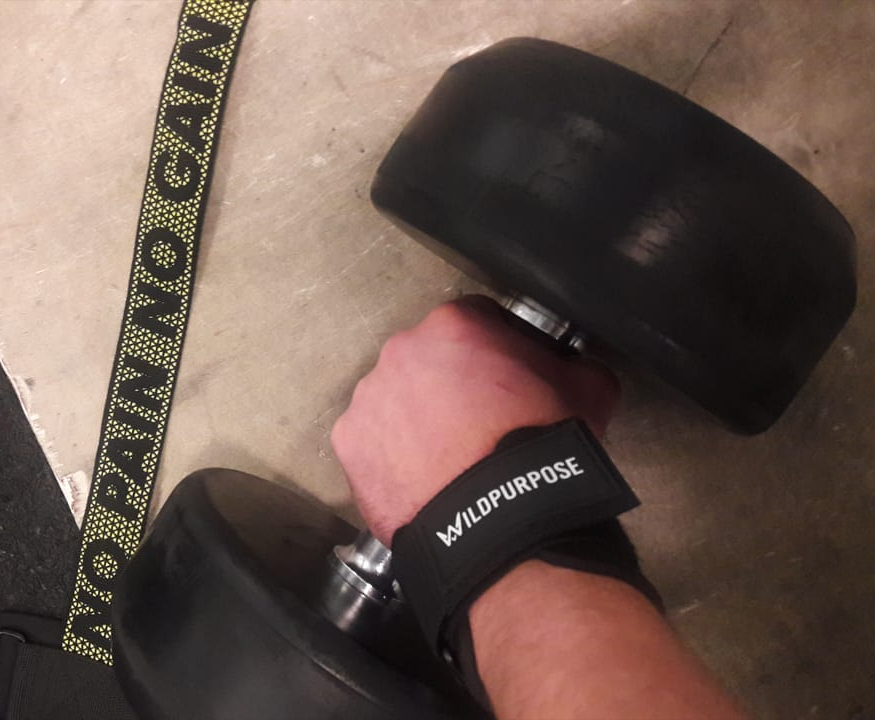 A hand lifting a weight