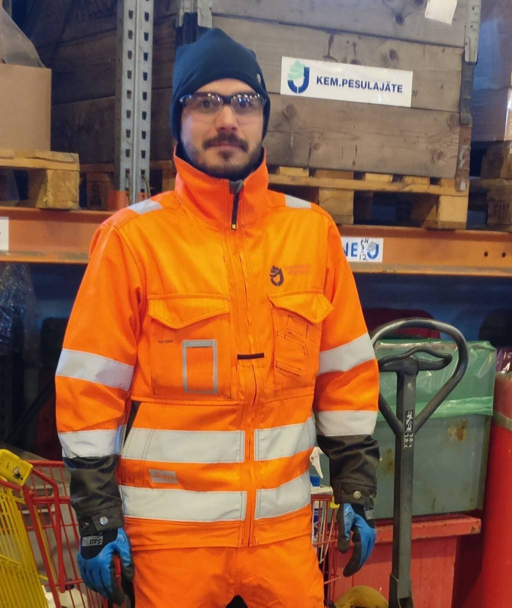 Kari in his working uniform at his work place