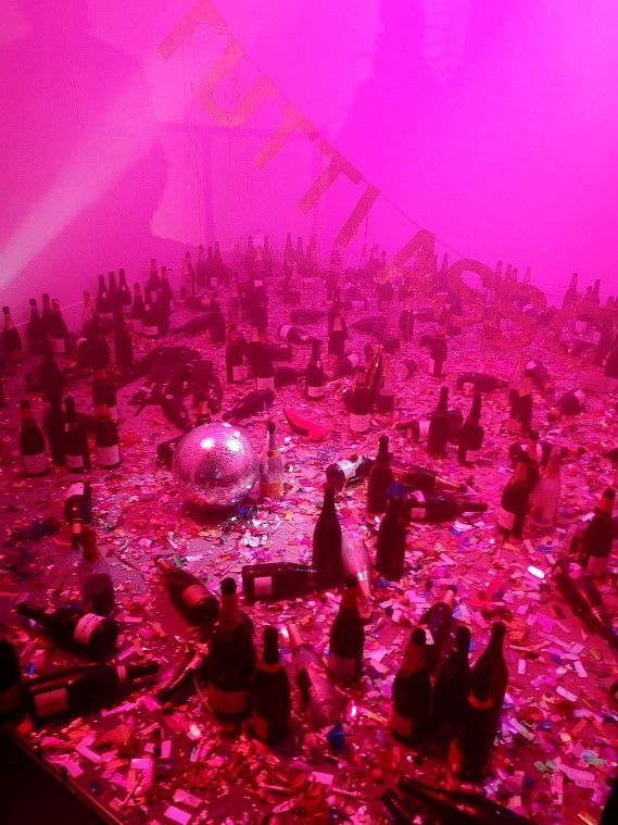 A work of art: pink background, empty bottles