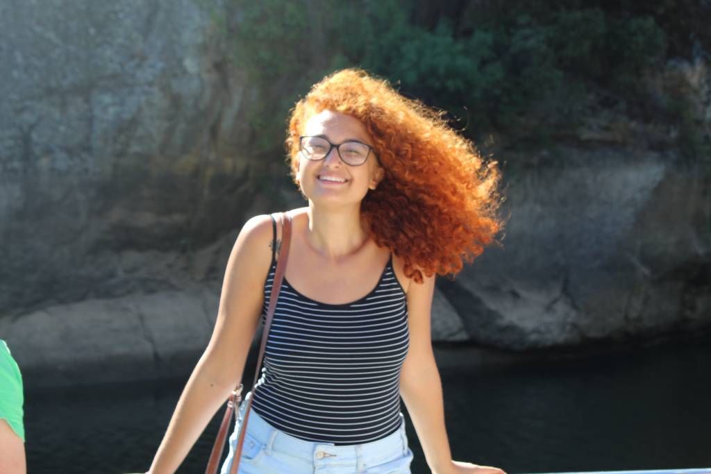 Raysa smiling and standing