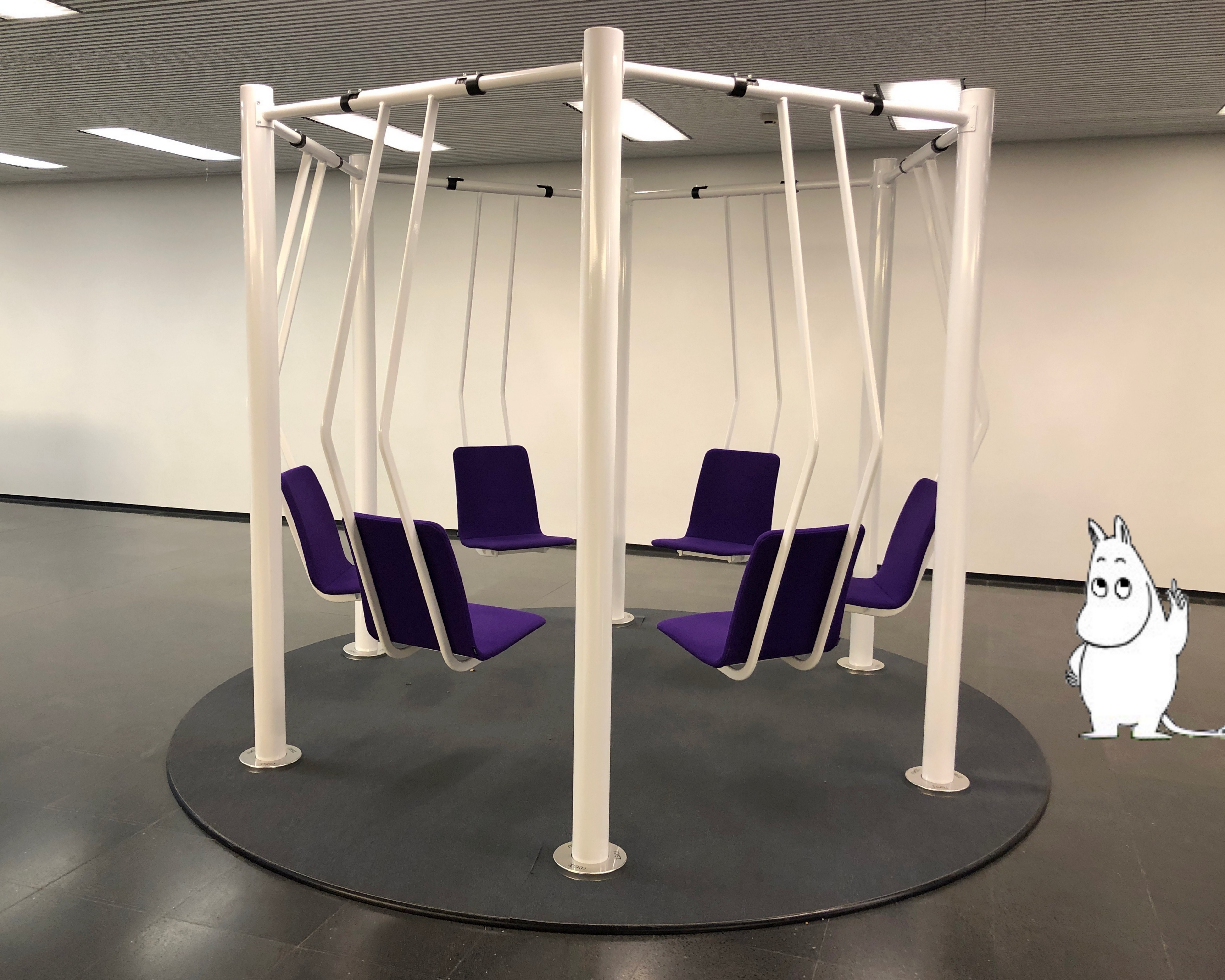 Moomintroll testing the swings at campus lobby.
