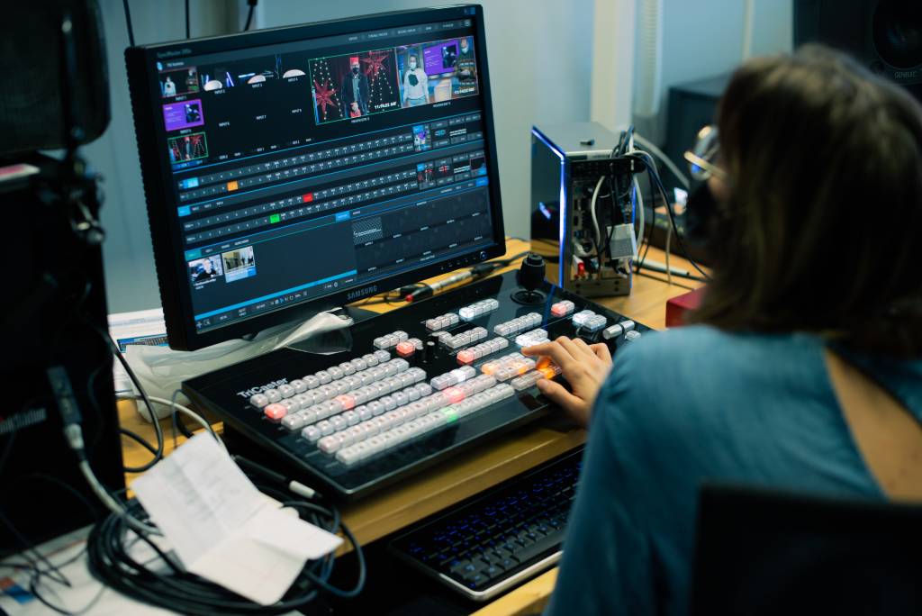 Maria Hiekkamäki at the TriCaster directing an event stream.