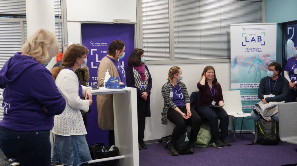five people attending social and health care session.