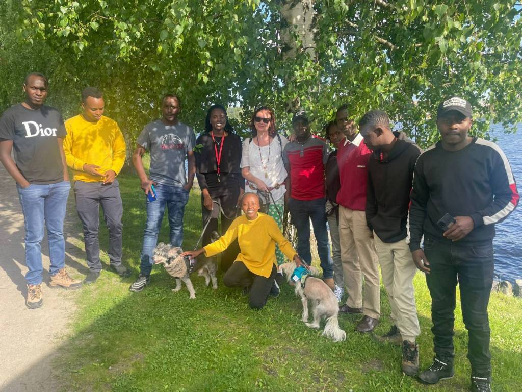 People standing by forest.