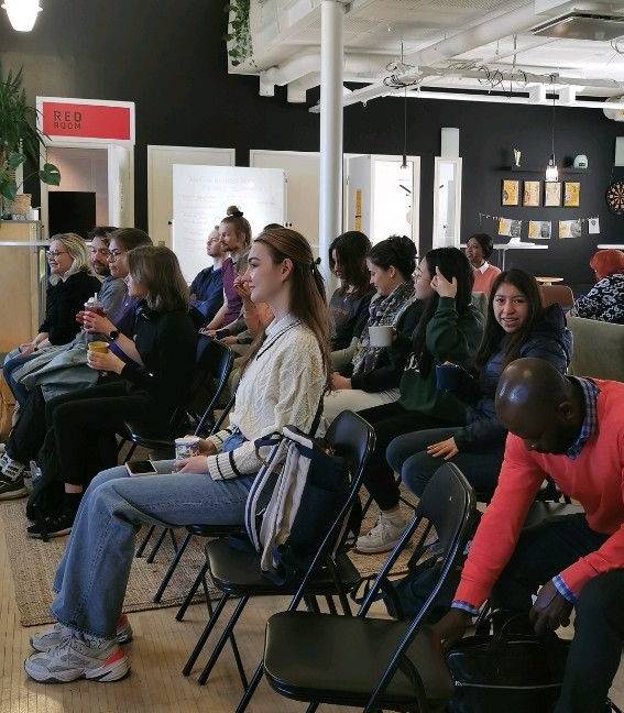A group of people waiting for the event to start.