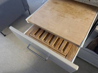 The chopping board, and the bread board below it.