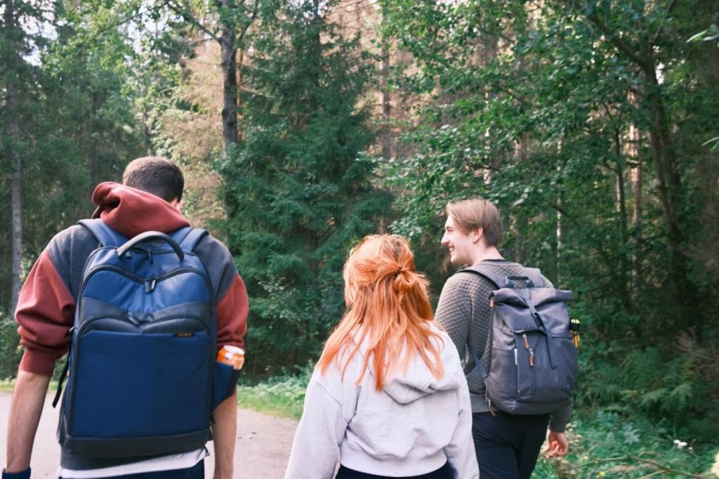 Three people hiking.