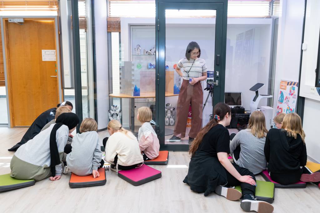 Pupils and students studying together in small groups