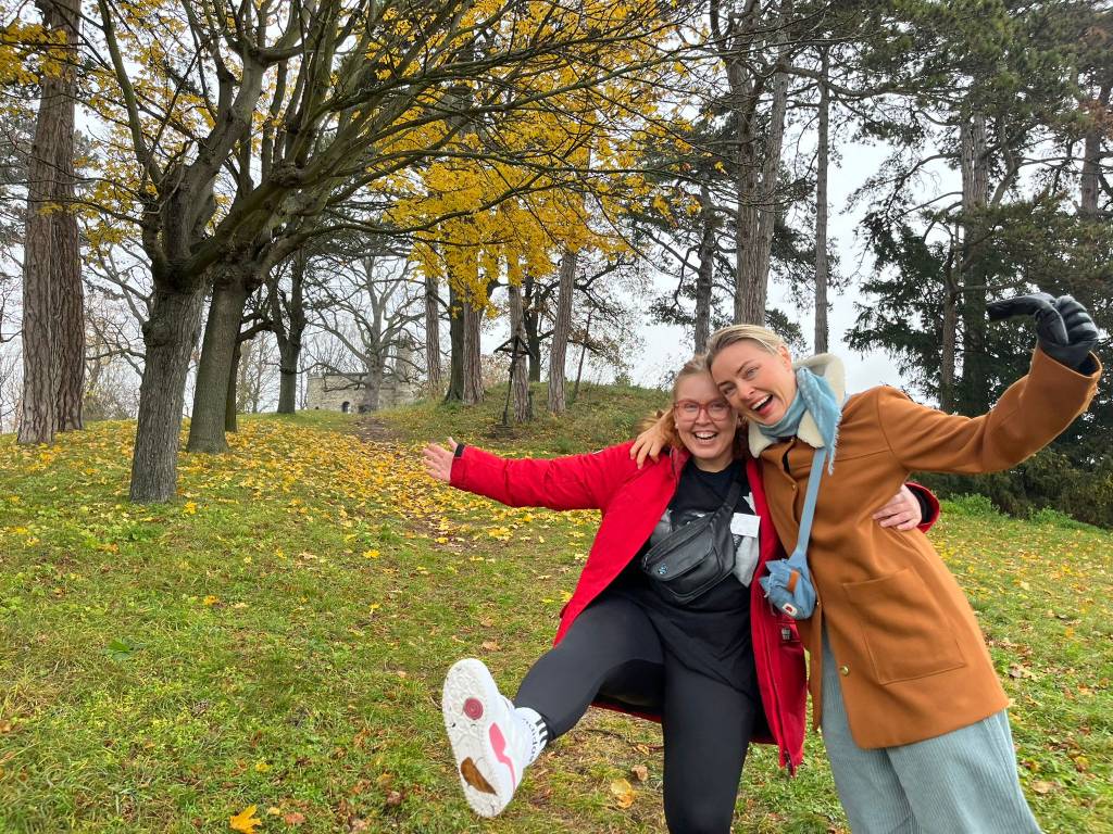 Two women smiling outside.