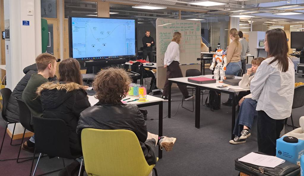 Students programming Nao robot.