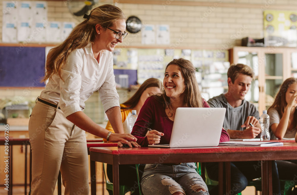 Teacher and students in classroom.