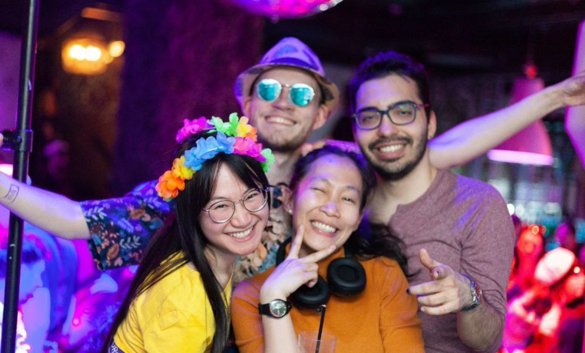 A friend group of four students at Symposium-party.