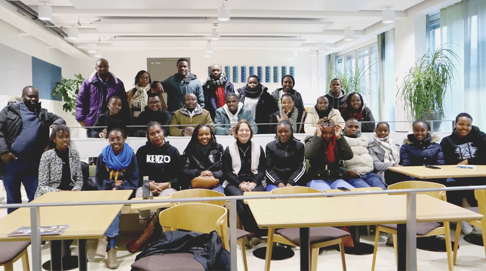 A group picture of students taken in a classroom.