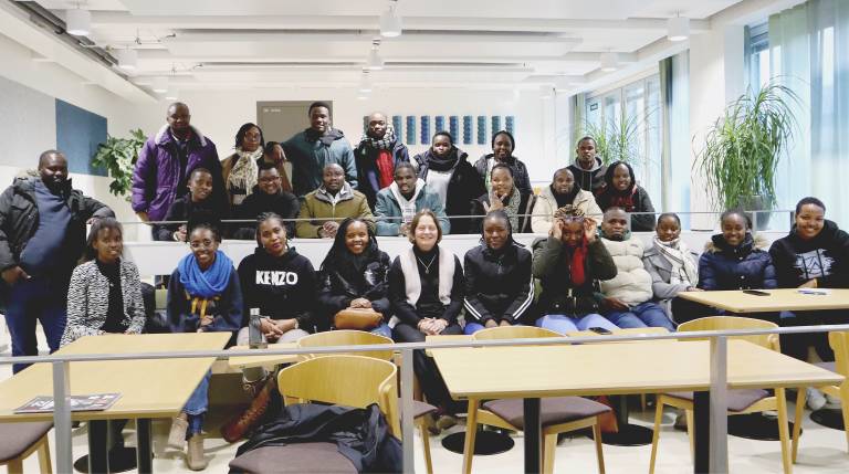 A group picture of students taken in a classroom.