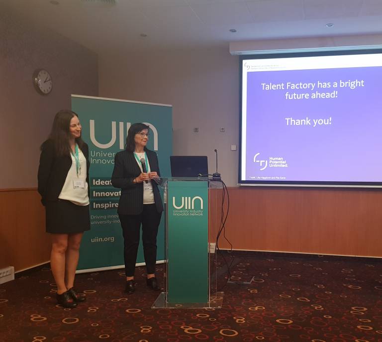 Piia Kanto and Ulla Häggblom standing on a stage.