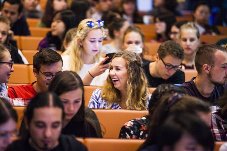 The photo is of students in a classroom together