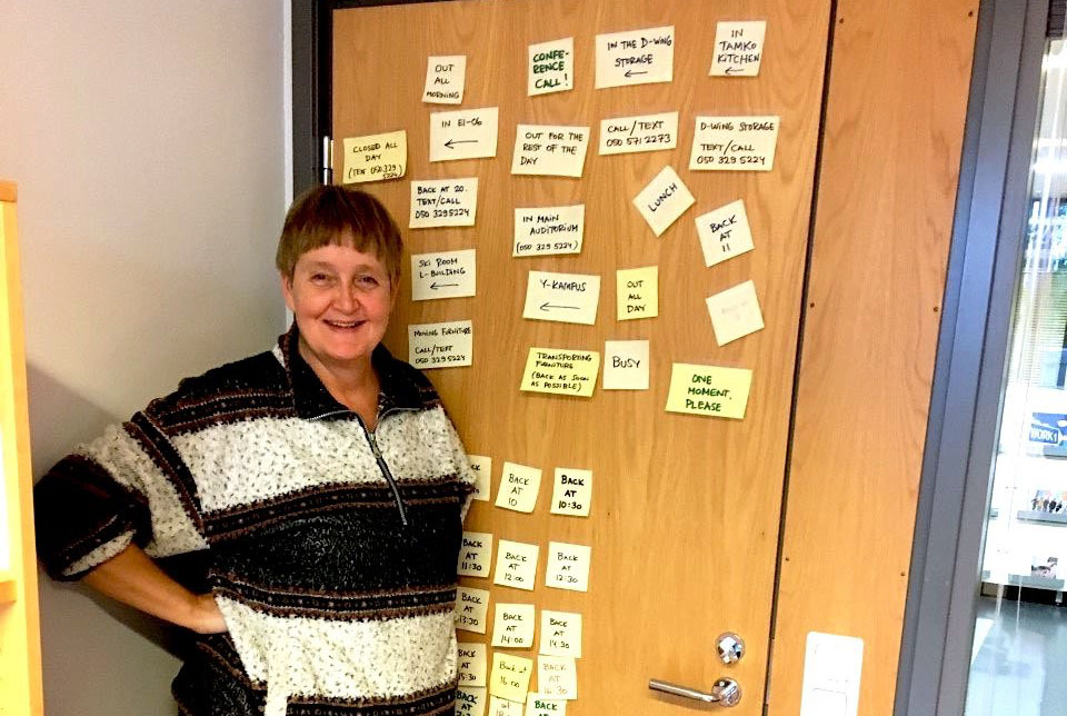 TAMK's social counsellor Mirja standing next to her office door