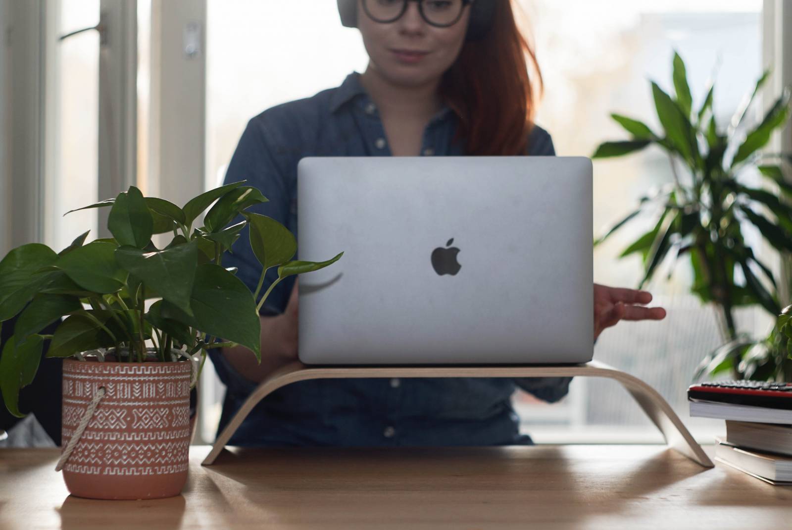 A woman looking at her laptop.