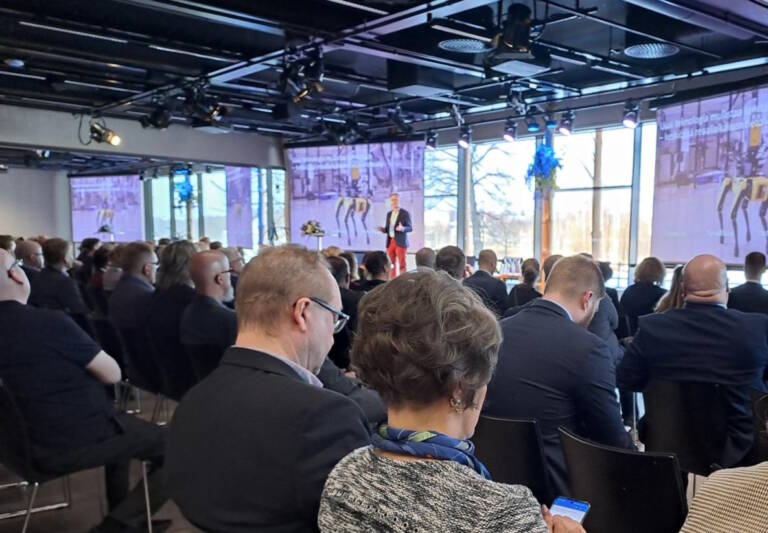 Audience looking towards the stage.