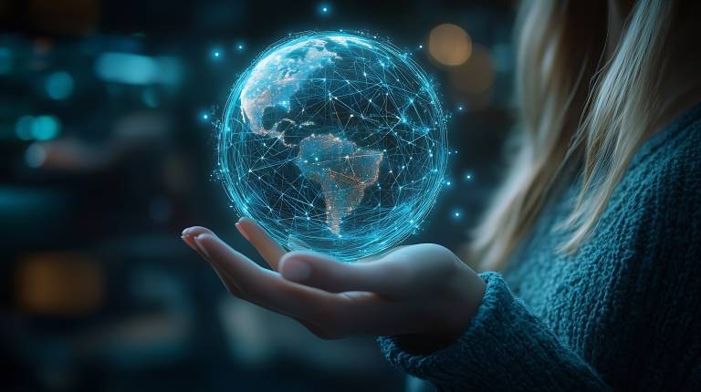 A hand holding the globe.