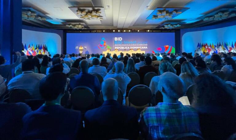 Audience looking at the stage in dim lightning.