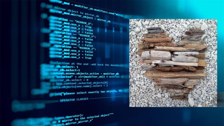 Näyttö, jossa on koodia sekä oksista koottu sydän hiekalla.