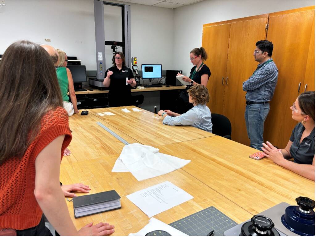 People standing and sitting around the table.