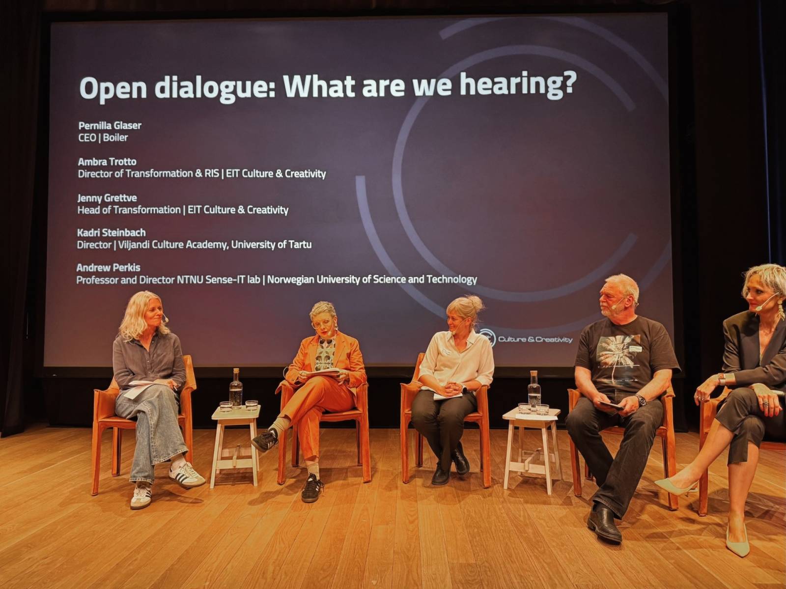 Picture shows five people discussing in the EIT Culture & Creativity North Partner Meeting in Stockholm.