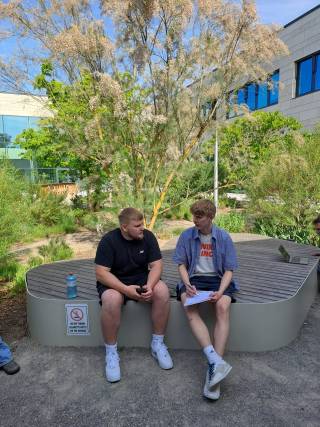 In the picture two participants are discussing their entrepreneurial competencies.